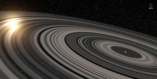 تجسم یک هنرمند از یک سیستم حلقه ای که به دور سیاره جوان و بزرگ یا کوتوله قهوه ای J1407b در حال چرخش است. همانند سال 2007، حلقه های نشان داده شده، باعث گرفتگی ستاره مادر شده اند. تجزیه و تحلیل دقیق حاصل از مشاهدات نشان می دهد که ظاهرا بیش از 30 حلقه مجزا در اطراف J1407b وجود دارد.  اعتبار عکس: Ron Miller